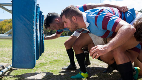 rugby players training in field